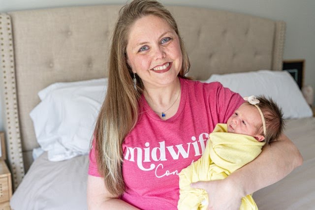 Constance Tucker holding newborn